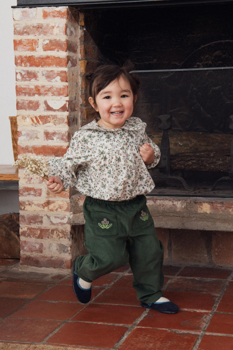 Bruges baby pants with cross-stitch embroideries