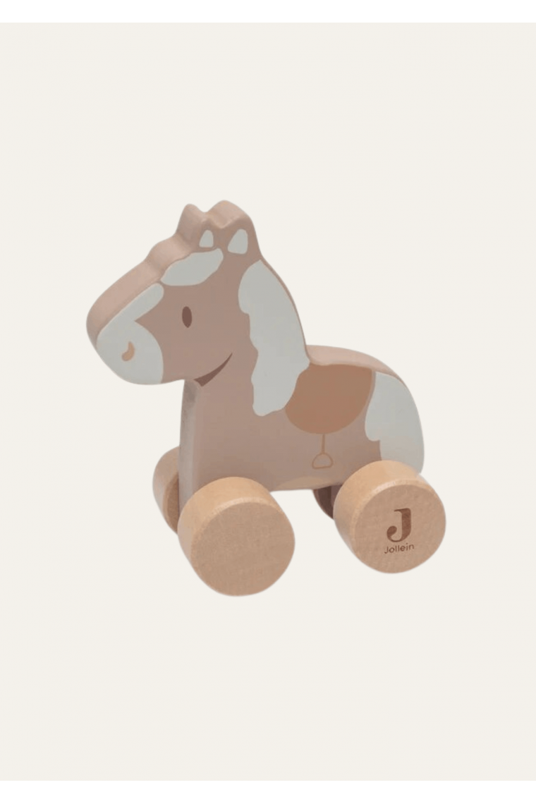 Cheval en bois sur roulettes de Jollein Cheval en bois sur roulettes de Jollein