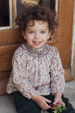 Margot smocked baby blouse in Liberty