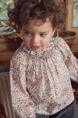 Confetti smocked baby blouse in Liberty