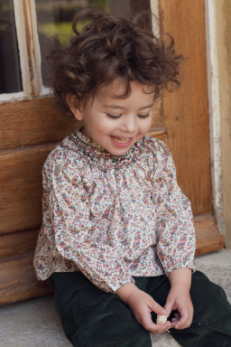 Margot smocked baby blouse in Liberty